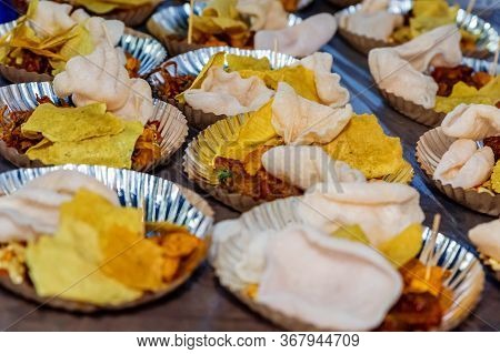 Variety Of Food Snacks Served On Disposable Plates At Picnic Party In Kathmandu,food Background.sele