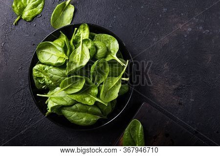 Fresh Baby Spinach On A Plate. Juicy Spinach Leaves. Diet Concept. Vegan Food. Green Fresh Spinach.