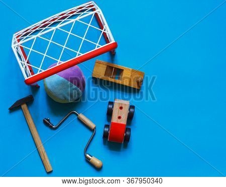 Childrens Toys And Tools On A Blue Background, Upper Vd With Space