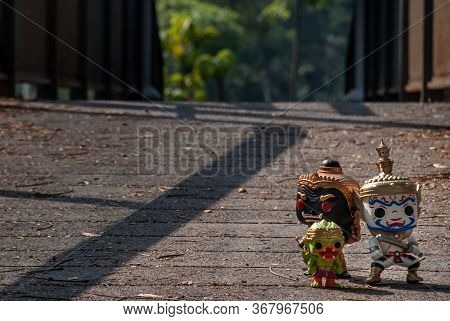Ravana, Giantess And Hanuman Walking On The Bridge In The Park. Traveller Doll.
