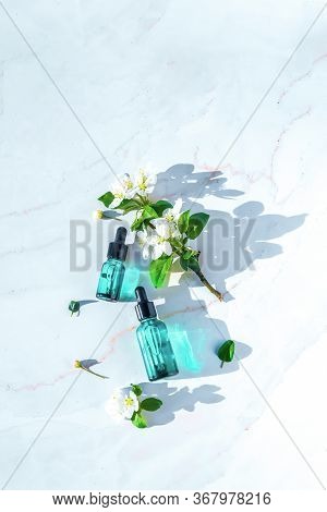 Natural Serums Flat Lay, Minimalism. With Flowers. Concept Of Cosmetic Injection Is Hyaluronic Acid,