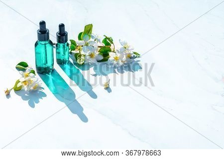 Natural Serums Flat Lay, Minimalism. With Flowers. Concept Of Cosmetic Injection Is Hyaluronic Acid,