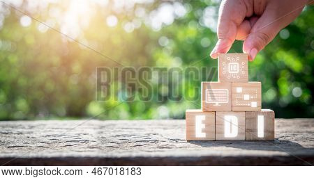 Edi-electronic Data Interchange Concept, Man Hand Holding Wooden Cube Block With Virtual Screen Edi 