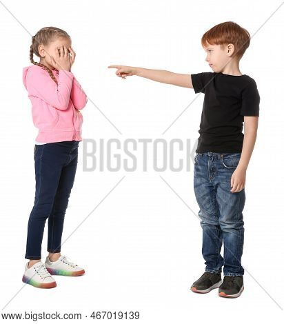 Boy Pointing At Upset Girl On White Background. Children's Bullying