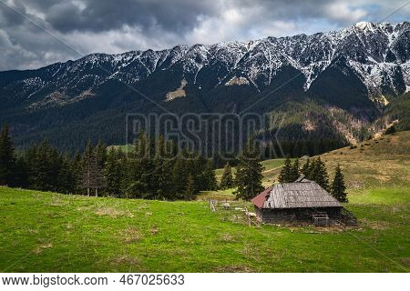 Spectacular Alpine Rural Place With Rickety Wooden Hut And High Snowy Piatra Craiului Mountains, Pes