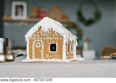 Home Scene Of A Gingerbread House On The Background Of The Kitchen