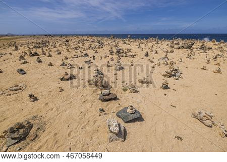 Beautiful View Of Northern Coast Of Caribbean Sea Of Island Of Aruba With Small Cairns Lined.
