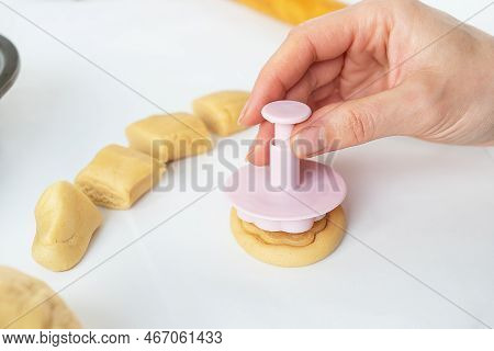 The Process Of Making Cookies With Shapes In The Form Of Flowers, A Rolling Pin And A Tray, The Conc