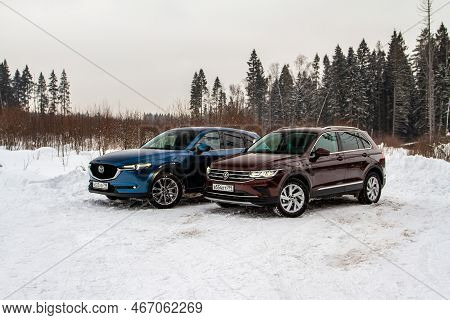 Moscow, Russia - January 22, 2022. Volkswagen Tiguan (ad1) 4motion, And Mazda Cx5 (kf) Skyactive, Su