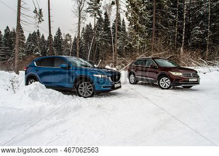 Moscow, Russia - January 22, 2022. Volkswagen Tiguan (ad1) 4motion, And Mazda Cx5 (kf) Skyactive, Su