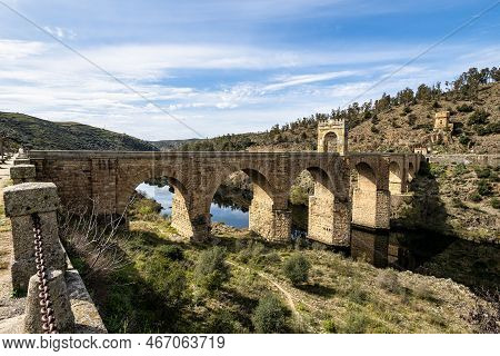 Roman Bridge Over The Tagus, Tajo River In Alcantara, Caceres Province, Extremadura, Spain. The Roma
