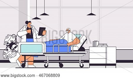 Nurse Taking Care Of Sick Senior Man Patient Lying In Hospital Bed Care Service Concept Clinic Ward 
