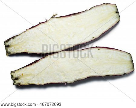 A Long Ugly Radish Cut In Half. Radish Variety. Red Root Crop Cracked. Wrinkled Root. Salad Ingredie