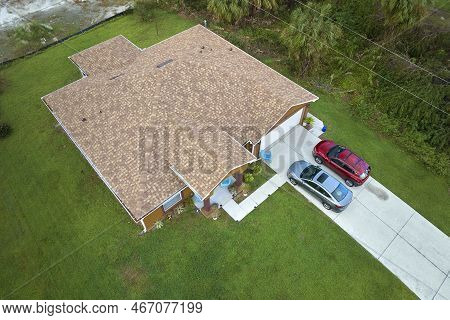 Aerial View Of Typical Contemporary American Private House With Roof Top Covered With Asphalt Shingl