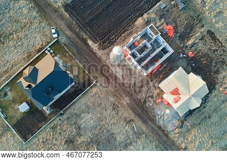 Aerial View Of Unfinished Frame Of Private House Foundation Under Construction.