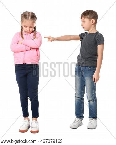Boy Pointing At Upset Girl On White Background. Children's Bullying