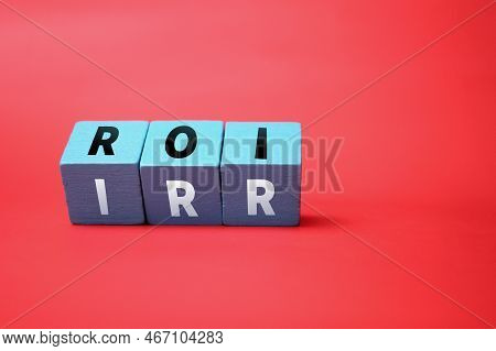 Colored Cubes With Letters Roi And Irr Or Return On Investment And Internal Rate Of Return