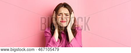 Close Up Of Distressed And Bothered Young Woman Covering Her Ears, Grimacing Cant Bear This Anymore,