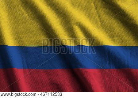 Colombia Flag With Big Folds Waving Close Up Under The Studio Light Indoors. The Official Symbols An