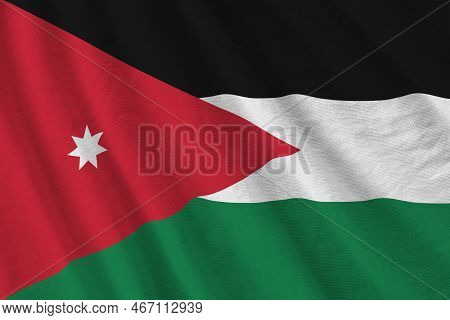 Jordan Flag With Big Folds Waving Close Up Under The Studio Light Indoors. The Official Symbols And 