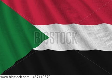 Sudan Flag With Big Folds Waving Close Up Under The Studio Light Indoors. The Official Symbols And C