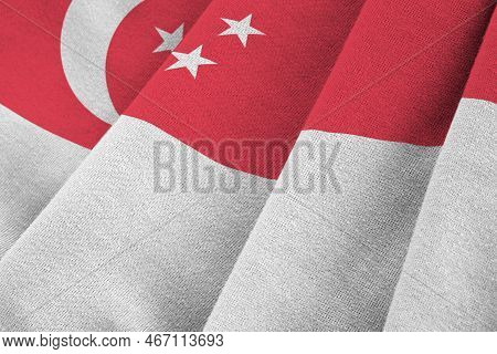 Singapore Flag With Big Folds Waving Close Up Under The Studio Light Indoors. The Official Symbols A