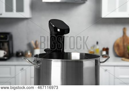 Pot With Sous Vide Cooker In Kitchen, Closeup. Thermal Immersion Circulator