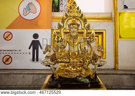 Yellow Ancient Angel Deity Lord Statue Of Monday For Thai People Travel Visit Respect Praying And Bl