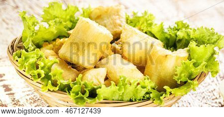 Fried Cassava With Vegetables And Sauces, A Typical Brazilian Snack Served In Restaurants And Bars, 