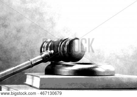 Abstract Photo With Wooden Gavel And Book With Codes As Symbol Of Of Rule Of Law With Judge's Gavel,
