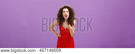 Woman In Fury Fighting With Husband Over Money Making Italian Gesture With Fingers Shouting And Yell
