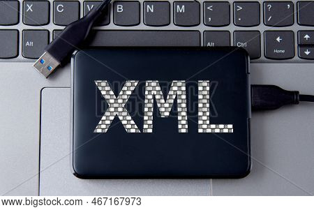 Xml (extensible Markup Language) - Acronum On An External Drive In Gray Letters On The Background Of