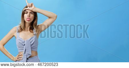 Waist-up Shot Of Stylish Self-assured Woman With Tattoo Feeling Like Winner Mocking Over Losers Stic
