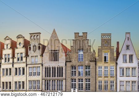Muenster, Germany - April 29, 2022: Scenic View To Facade Of Old Historic Houses In Panoramic View A