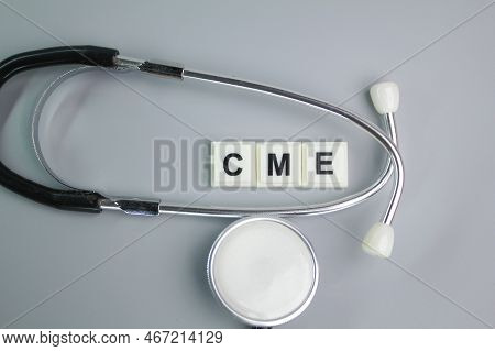 Stethoscope And The Letter Cme Or Continuing Medical Education. Medical Learning Concept