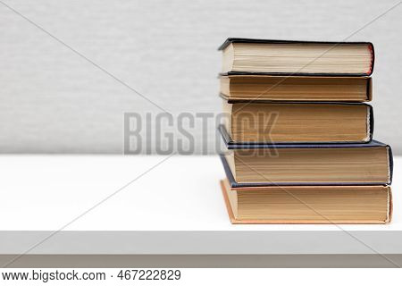 A Stack Of Old Books Lies On The Table. Old Book. Yellow Book Page.