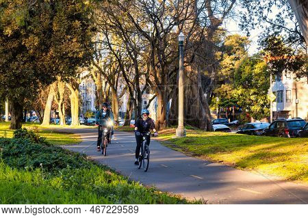 San Francisco, United States - February 11 2020 : With Helmets On These Commuters Are On The Cycling