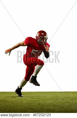 Professional American Football Player In Sports Uniform And Protective Helmet In Action Isolated Ove