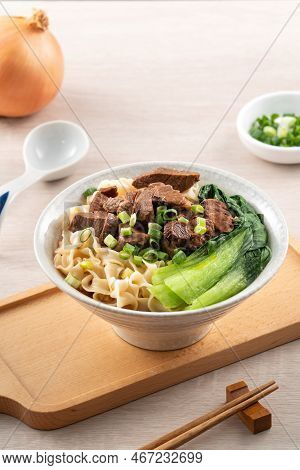 Beef Noodle Soup. Taiwanese Famous Food In A Bowl On Wooden Table.