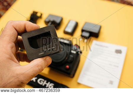 Paris, France - Nov 20, 2022: Male Hand Holding Lumix Vsk0815l Charger For Rechargable Li-ion Batter