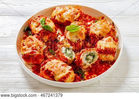 Chicken Rollatini With Spinach Ricotta Filling In Marinara Sauce Topped With Mozzarella Cheese And F