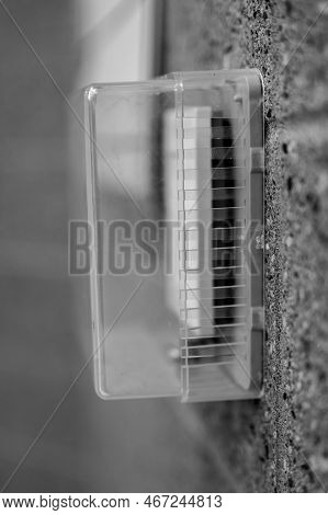 Selective Focus On Covered Thermostat That Is Locked To Prevent Changing Temperatures