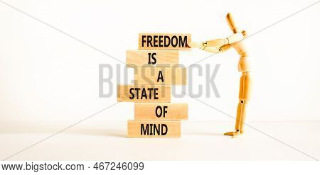 Freedom In Mind Symbol. Concept Words Freedom Is A State Of Mind On Wooden Blocks On A Beautiful Whi