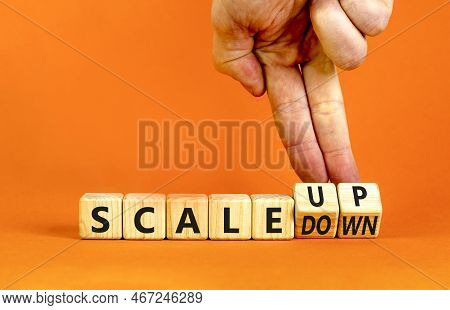 Scale Up Or Down Symbol. Concept Words Scale Up Scale Down Wooden Cubes. Businessman Hand. Beautiful