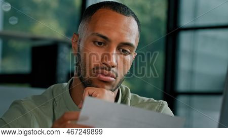 Calm African Latin Guy Man Student Entrepreneur Open Envelope Notification From Bank Test Result Inv