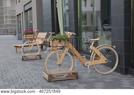 Bikes With Beautiful Flowers Near Building On City Street