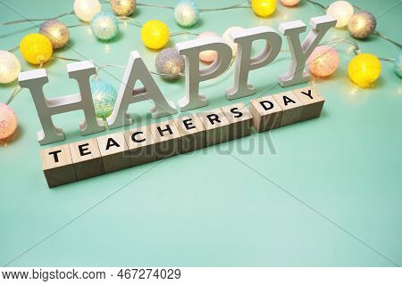 Happy Teachers Day Alphabet Letter With Led Cotton Balls On Green Background