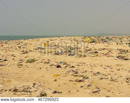 Warang, Mbour, Senegal - Circa January 20222. Beach Sand Of Atlantic Ocean With So Many Garbage Plas