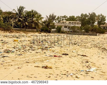 Warang, Mbour, Senegal - Circa January 20222. Beach Sand Of Atlantic Ocean With So Many Garbage Plas