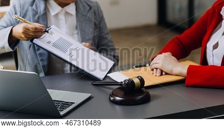 Male Lawyer Working With Contract Papers And Wooden Gavel On Tabel In Courtroom. Justice And Law ,at
